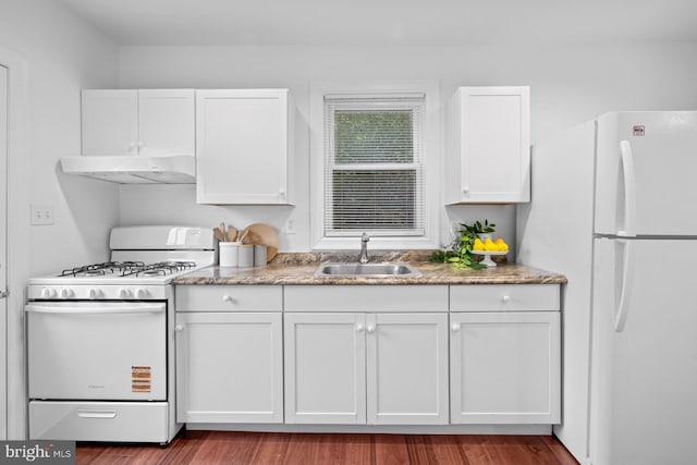 950 E W Hwy, Takoma Park, MD 20912 - kitchen with white appliances, under cabinet range hood, white cabinets, and wood finished floors