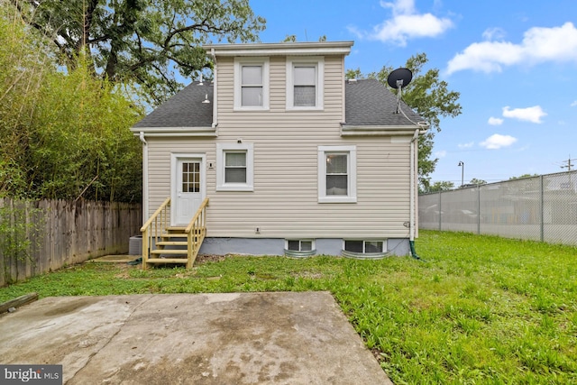 950 E W Hwy, Takoma Park, MD 20912 - rear view of property featuring entry steps, a fenced backyard, a patio, and a shingled roof