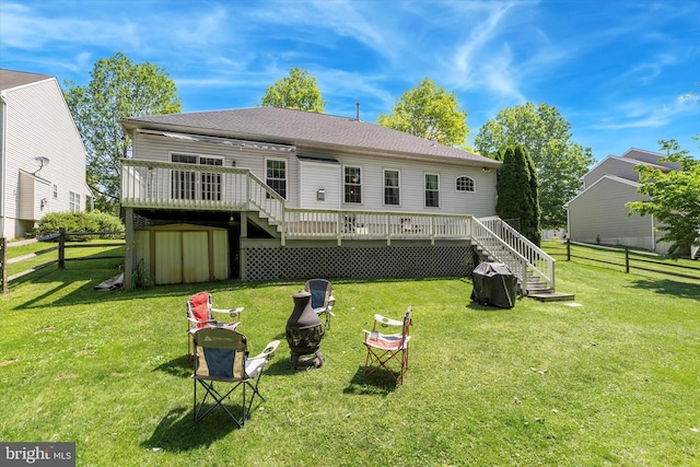 302 Cressent Ct, East Fallowfield Township, PA 19320 - back of house with stairway, a deck, a storage unit, and an outdoor fire pit