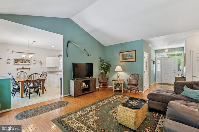 302 Cressent Ct, East Fallowfield Township, PA 19320 - living area featuring hardwood / wood-style flooring, lofted ceiling, and a chandelier