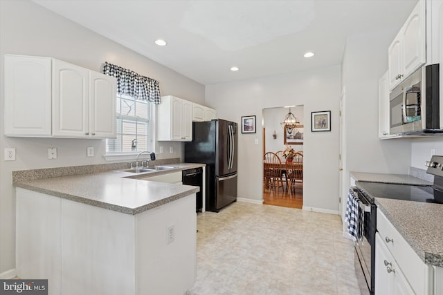 302 Cressent Ct, East Fallowfield Township, PA 19320 - kitchen with appliances with stainless steel finishes, white cabinets, recessed lighting, light flooring, and a peninsula