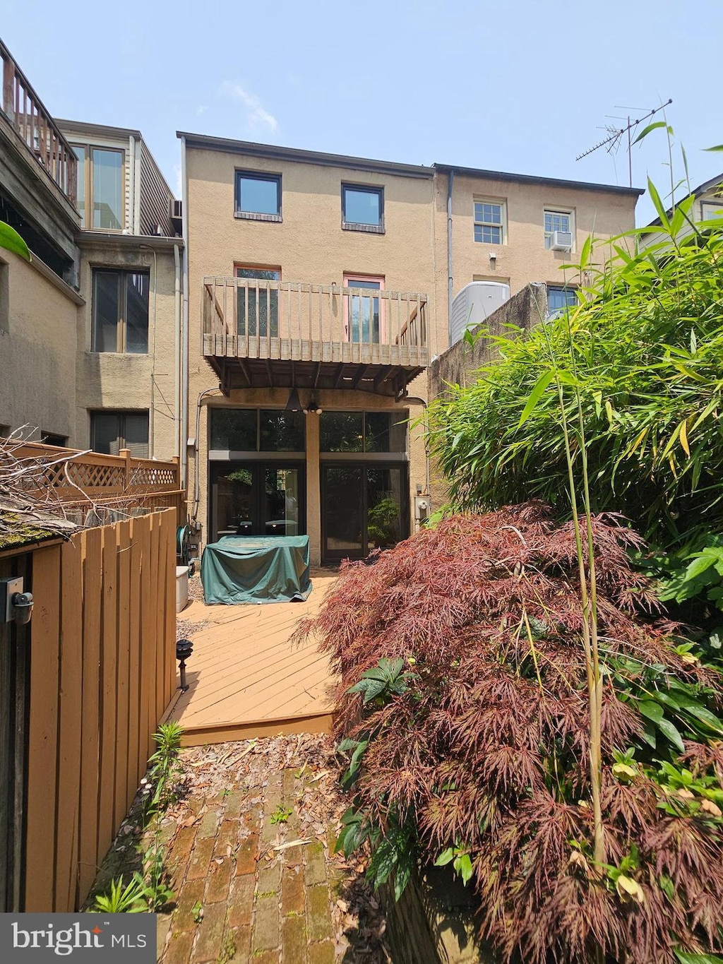 135 W Hill St, Baltimore, MD 21230 - back of house with a deck and stucco siding