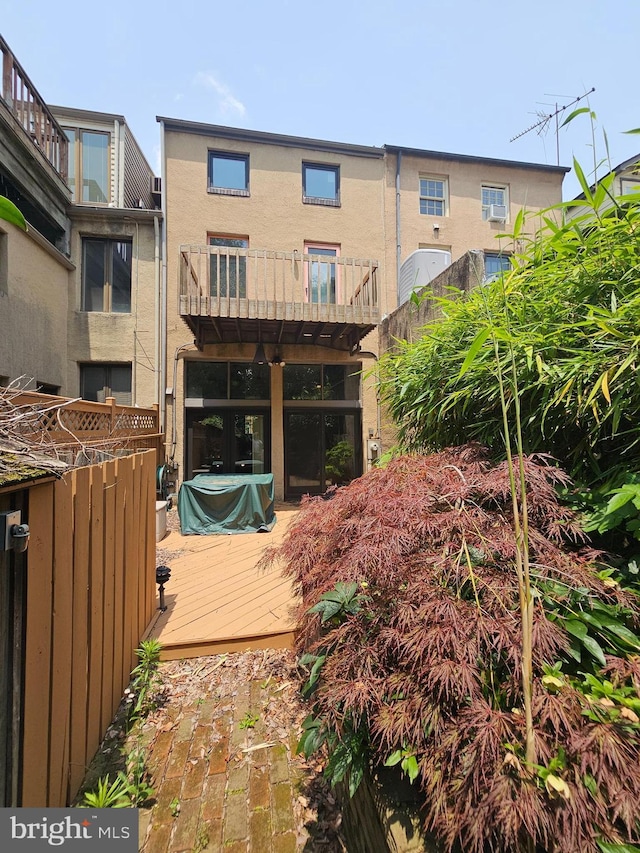 135 W Hill St, Baltimore, MD 21230 - back of house with a deck and stucco siding