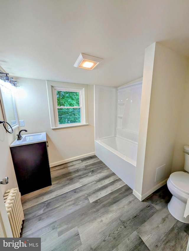 420 4th Ave, Parkesburg, PA 19365 - full bathroom featuring radiator, vanity, wood finished floors, and shower / bathtub combination
