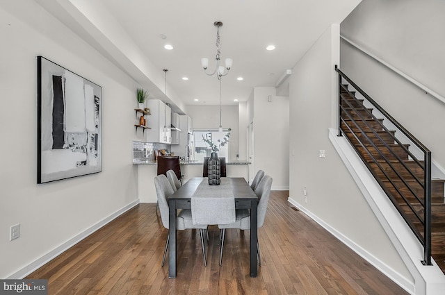 1620 N 5th Ct, Philadelphia, PA 19122 - dining space featuring a chandelier, dark wood-style flooring, recessed lighting, and stairs