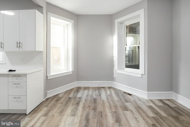 2332 N 25th St, Philadelphia, PA 19132 - unfurnished dining area featuring light wood finished floors and baseboards