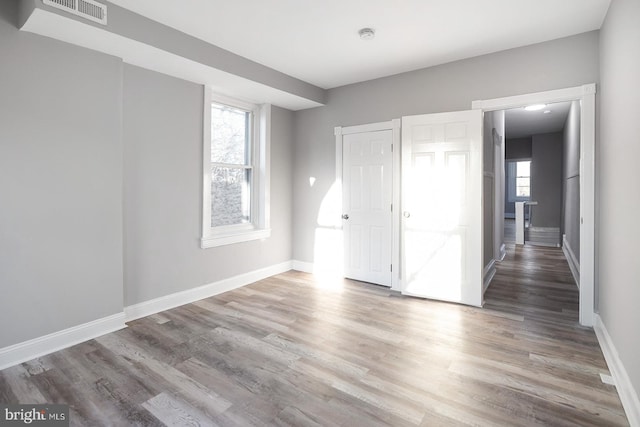 2332 N 25th St, Philadelphia, PA 19132 - unfurnished bedroom with baseboards and wood finished floors