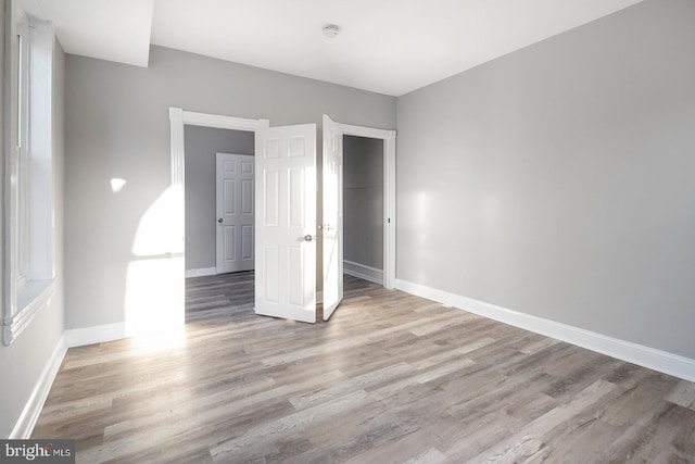 2332 N 25th St, Philadelphia, PA 19132 - unfurnished bedroom featuring light wood-style flooring and baseboards