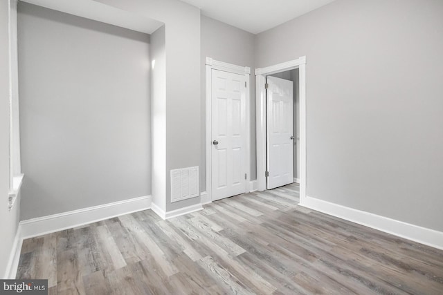 2332 N 25th St, Philadelphia, PA 19132 - unfurnished bedroom featuring wood finished floors and baseboards