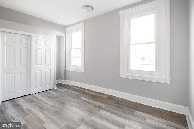 2332 N 25th St, Philadelphia, PA 19132 - unfurnished bedroom featuring wood finished floors and a closet