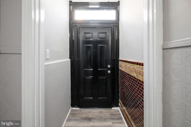 2332 N 25th St, Philadelphia, PA 19132 - entryway with wood finished floors and a wainscoted wall