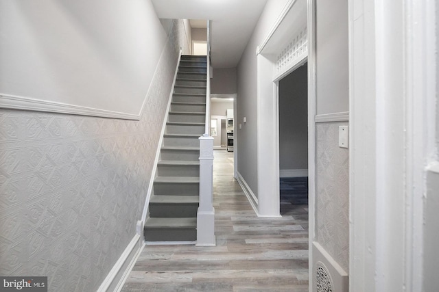 2332 N 25th St, Philadelphia, PA 19132 - stairs featuring wood finished floors