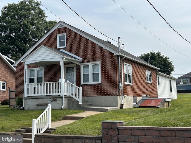 519 Jefferson St, East Greenville, PA 18041 - bungalow-style home featuring brick siding, a front lawn, and a porch