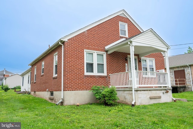 519 Jefferson St, East Greenville, PA 18041 - bungalow-style house featuring brick siding, covered porch, and a front yard