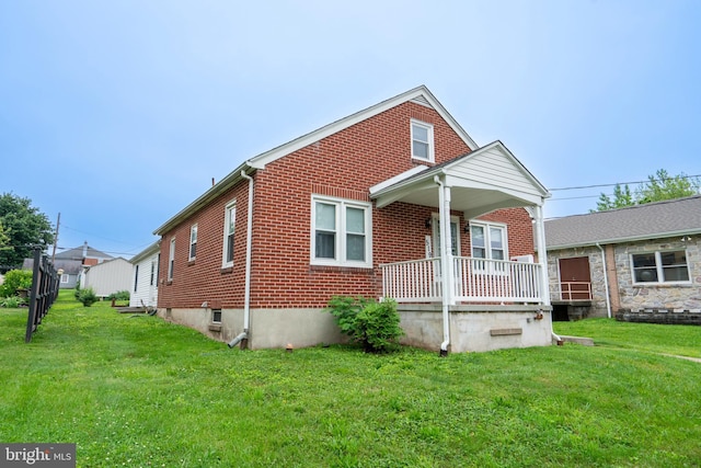 519 Jefferson St, East Greenville, PA 18041 - bungalow featuring a porch, brick siding, and a front yard