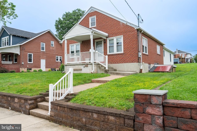 519 Jefferson St, East Greenville, PA 18041 - view of front of property with a front lawn and brick siding