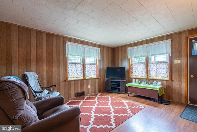 519 Jefferson St, East Greenville, PA 18041 - living area featuring healthy amount of natural light, wooden walls, and wood finished floors
