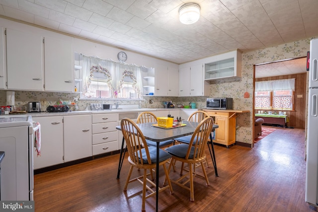 519 Jefferson St, East Greenville, PA 18041 - kitchen featuring open shelves, wallpapered walls, dark wood finished floors, stove, and light countertops