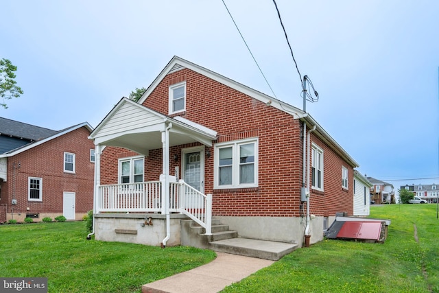 519 Jefferson St, East Greenville, PA 18041 - bungalow-style home featuring brick siding, a front lawn, and a porch