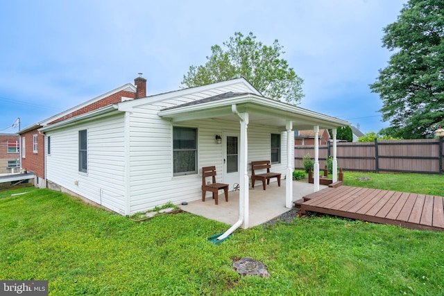 519 Jefferson St, East Greenville, PA 18041 - rear view of property featuring a chimney and a patio area
