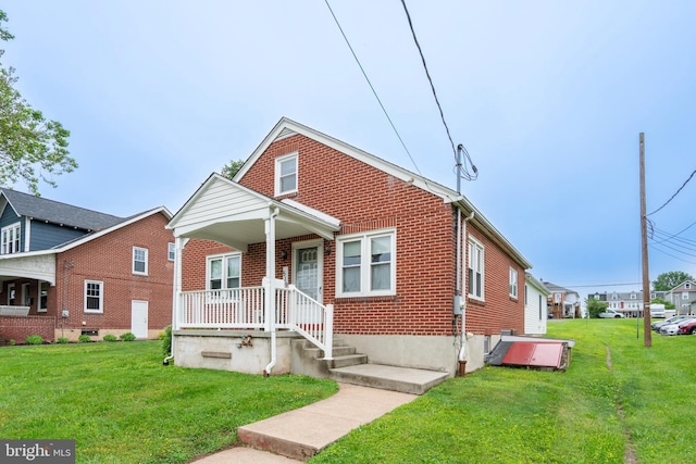 519 Jefferson St, East Greenville, PA 18041 - bungalow-style house with brick siding and a front yard