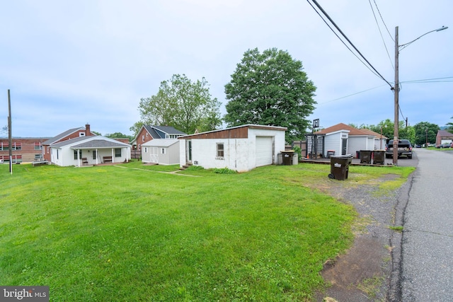519 Jefferson St, East Greenville, PA 18041 - view of grassy yard with a garage, an outdoor structure, and driveway
