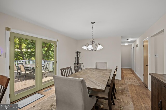 724 Franklinville Rd, Mullica Hill, NJ 08062 - dining area with light wood-style floors, a chandelier, and french doors