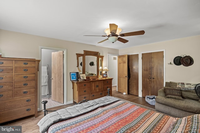 724 Franklinville Rd, Mullica Hill, NJ 08062 - bedroom with multiple closets, light wood finished floors, ensuite bath, and ceiling fan