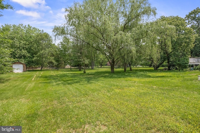 724 Franklinville Rd, Mullica Hill, NJ 08062 - view of green lawn featuring a garage and an outbuilding