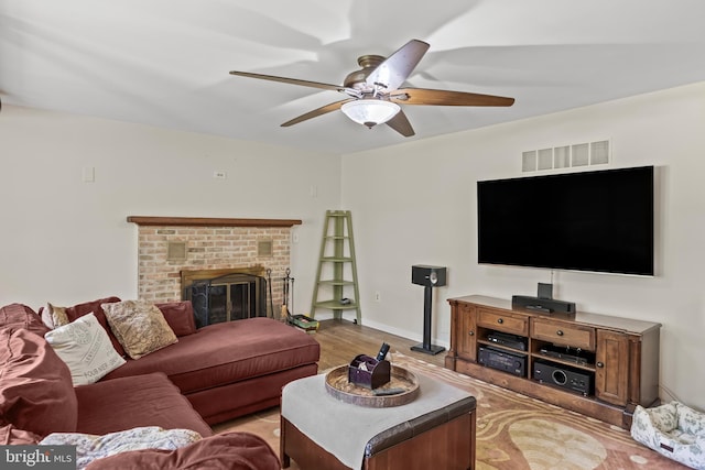 724 Franklinville Rd, Mullica Hill, NJ 08062 - living area featuring light wood-type flooring, a ceiling fan, and a brick fireplace