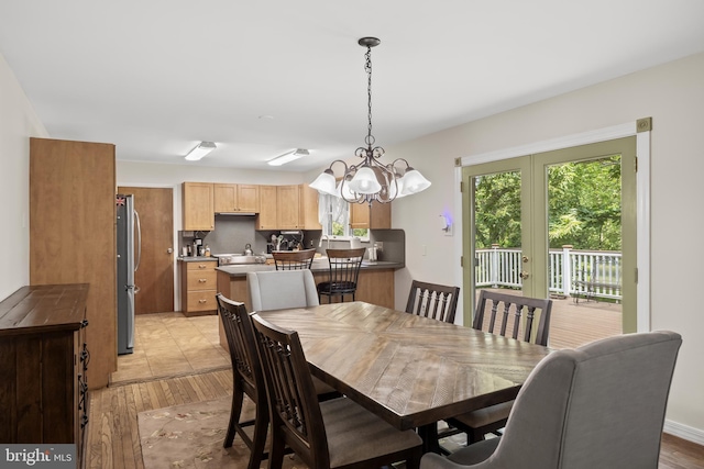 724 Franklinville Rd, Mullica Hill, NJ 08062 - dining area featuring light wood-style flooring and a chandelier