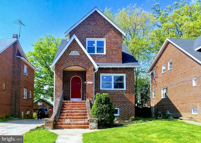 4118 Boarman Ave, Baltimore, MD 21215 - tudor house with brick siding, a front lawn, and roof with shingles