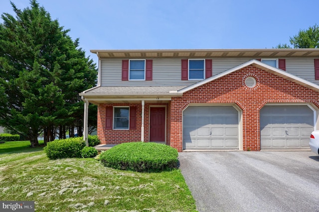 15 Jason Ave, Denver, PA 17517 - view of front facade with brick siding, asphalt driveway, a garage, a front lawn, and a shingled roof