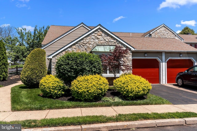 907 Potters Pl, Southampton, PA 18966 - view of front of home featuring stone siding, a garage, a shingled roof, and driveway