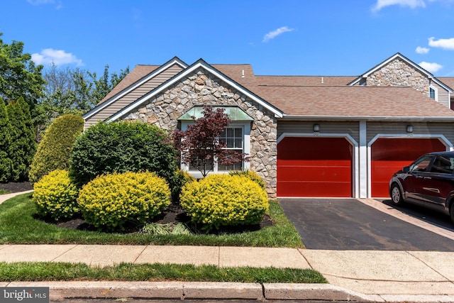 907 Potters Pl, Southampton, PA 18966 - view of front of property with stone siding, a shingled roof, a garage, and driveway