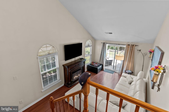 907 Potters Pl, Southampton, PA 18966 - living area with wood finished floors, a glass covered fireplace, and high vaulted ceiling
