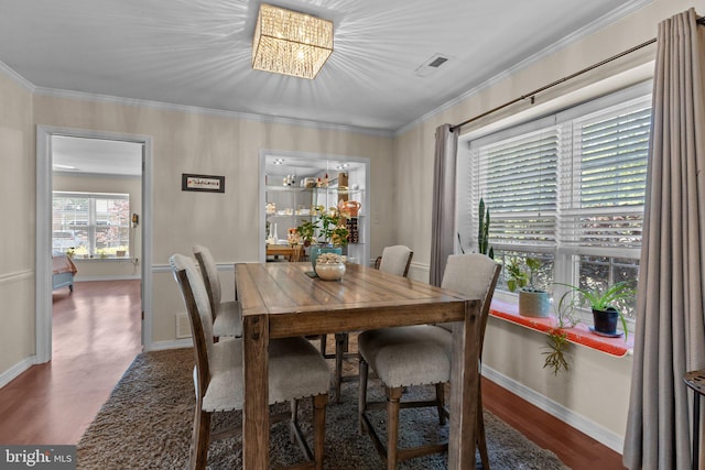 907 Potters Pl, Southampton, PA 18966 - dining space with wood finished floors, ornamental molding, and a chandelier