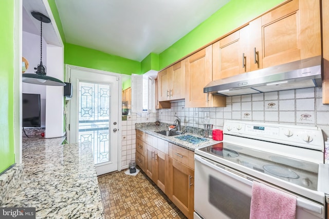 712 Chesapeake St SE, Washington, DC 20032 - kitchen featuring white range with electric stovetop, under cabinet range hood, tasteful backsplash, and light stone counters