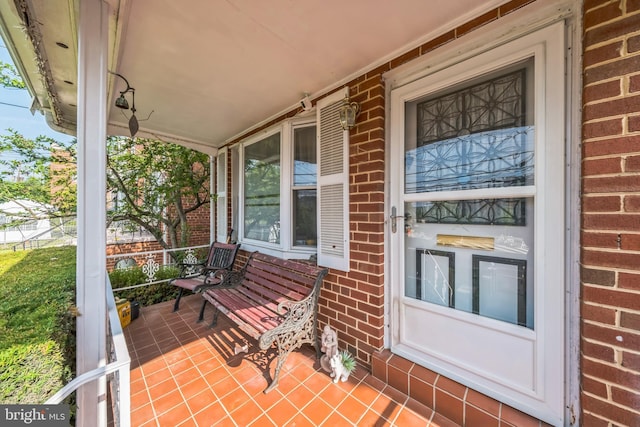 712 Chesapeake St SE, Washington, DC 20032 - property entrance featuring covered porch and brick siding
