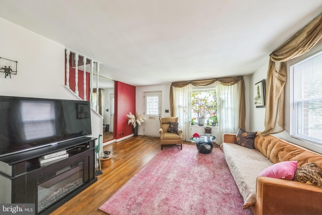 712 Chesapeake St SE, Washington, DC 20032 - living area featuring wood finished floors and stairs