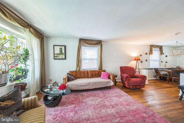 712 Chesapeake St SE, Washington, DC 20032 - living room with plenty of natural light, wood finished floors, and a chandelier