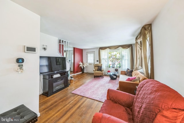 712 Chesapeake St SE, Washington, DC 20032 - living room featuring wood finished floors and baseboards