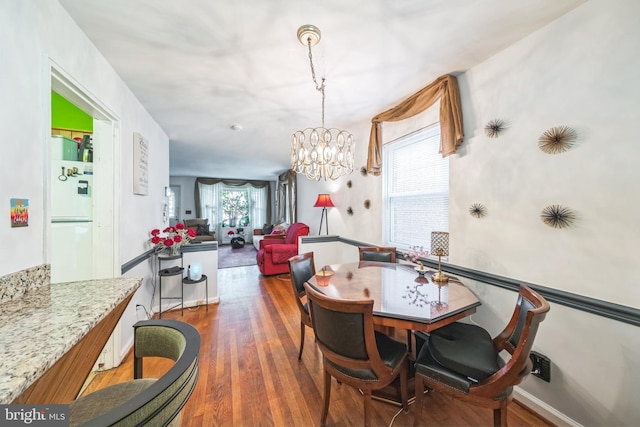 712 Chesapeake St SE, Washington, DC 20032 - dining area featuring a chandelier and wood finished floors