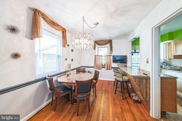 712 Chesapeake St SE, Washington, DC 20032 - dining space with wood finished floors and a chandelier