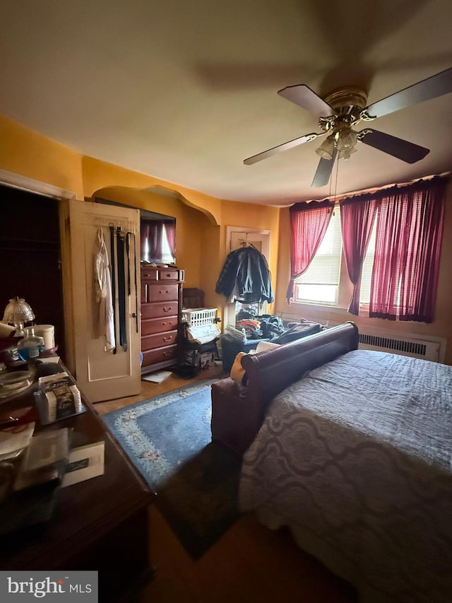 7221 Charles St, Philadelphia, PA 19135 - bedroom with ceiling fan, arched walkways, and a wall unit AC