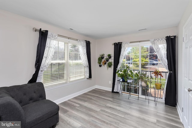 708 Zlotkin Cir, Freehold, NJ 07728 - sitting room with plenty of natural light and wood finished floors