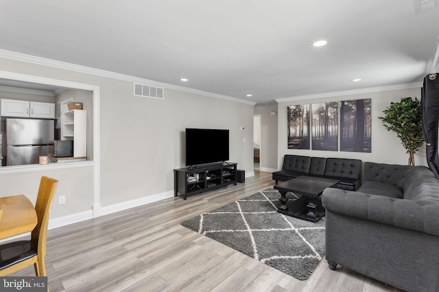 708 Zlotkin Cir, Freehold, NJ 07728 - living area featuring light wood finished floors, recessed lighting, and ornamental molding