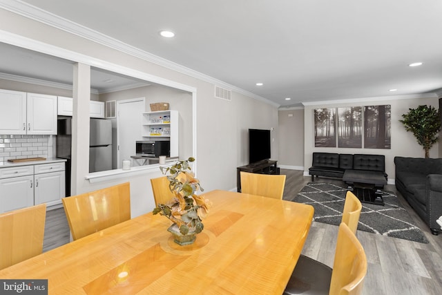 708 Zlotkin Cir, Freehold, NJ 07728 - dining space with wood finished floors, recessed lighting, and ornamental molding