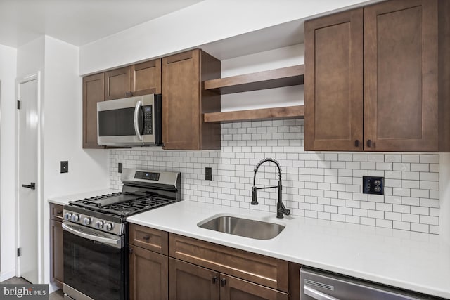 2193 Harbour Dr, Palmyra, NJ 08065 - kitchen with stainless steel appliances, open shelves, tasteful backsplash, light countertops, and dark brown cabinetry