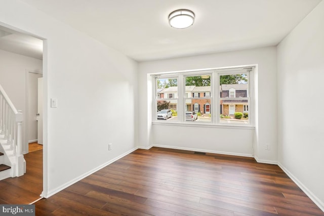 70 Oak Shade Rd, Gaithersburg, MD 20878 - spare room with stairs and dark wood finished floors